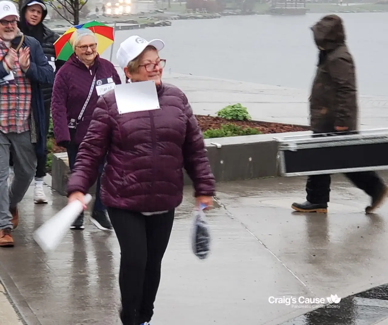 Sharon Burry approaches the end of the finish line on a wet, windy June 1st, 2024.