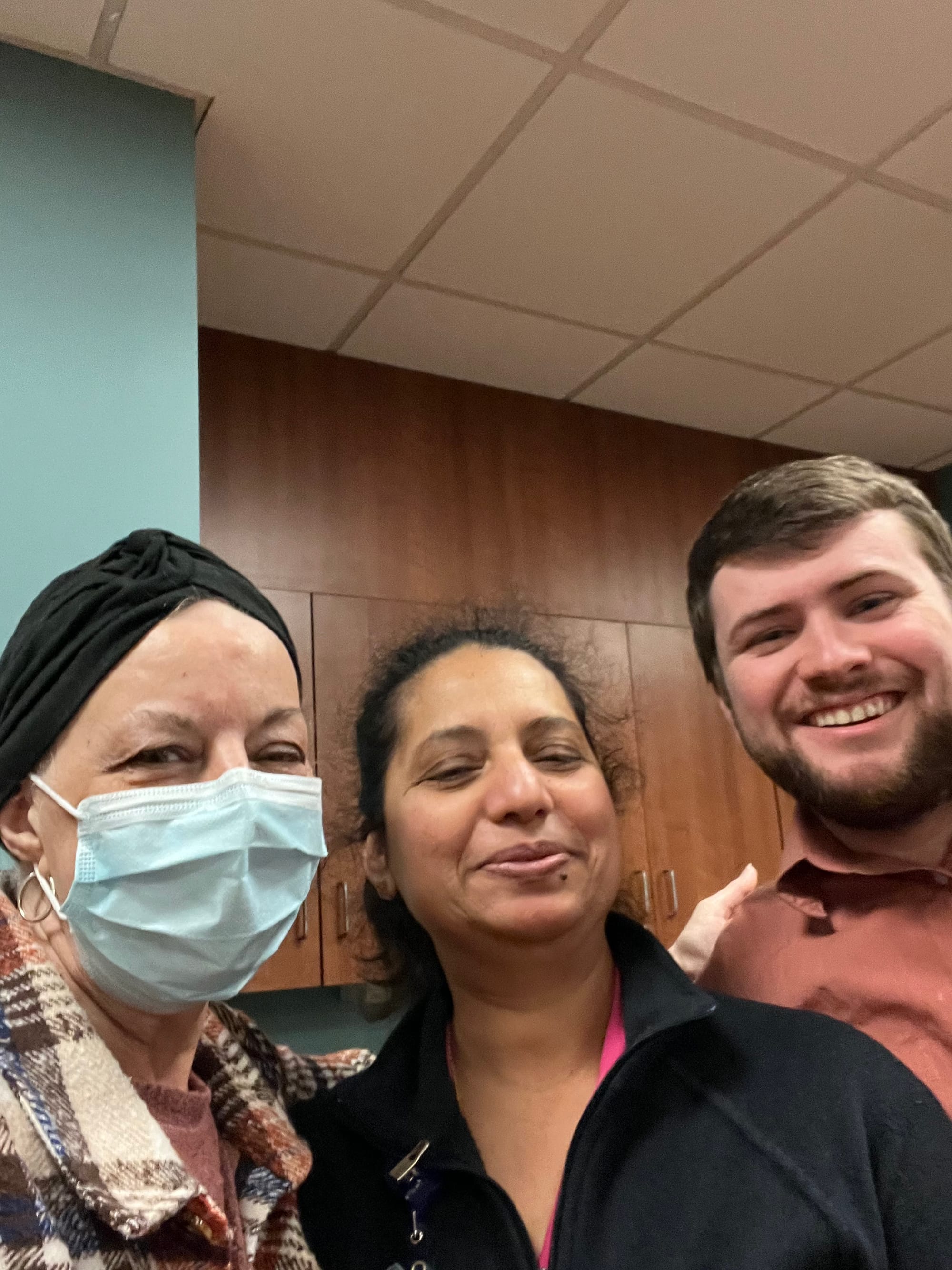 Heather Cutler smiles alongside her care team, reflecting her gratitude for the kindness and support she received during her treatment.